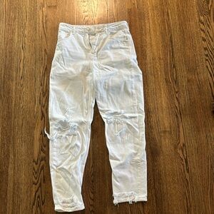 Distressed white denim jeans